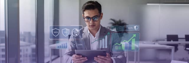 Business professional analyzing AI-driven search performance and growth metrics on a digital dashboard in a modern office.