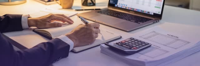 Business professional analyzing AI-driven search performance and growth metrics on a digital dashboard in a modern office.