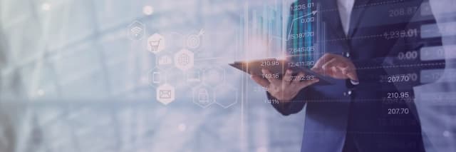 Business professional analyzing digital financial data on a tablet, with icons representing tax, e-commerce, and compliance analytics.