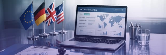 Laptop displaying VAT registration dashboard with international flags including EU, Germany, UK, and USA, representing global tax compliance and cross-border business operations.