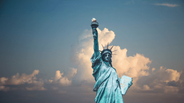 The Statue of Liberty holding a torch, symbolizing enlightenment and freedom.