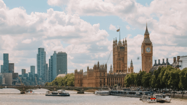 Big Ben clock tower stands tall beside the iconic Palace of Westminster in London, showcasing stunning architecture